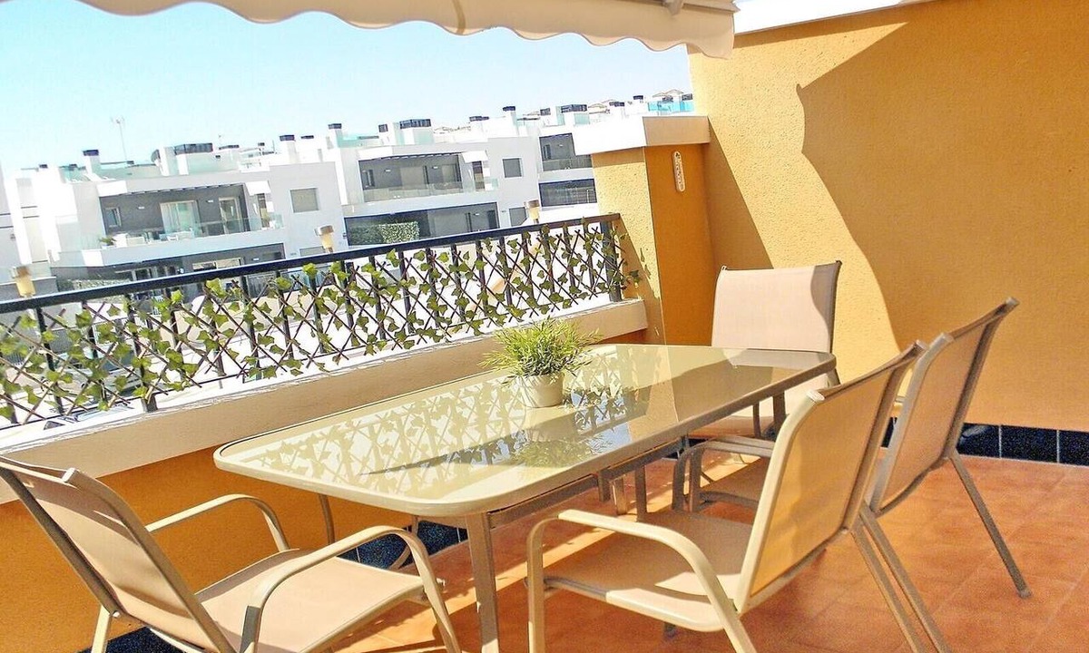 Orihuela Costa Apartment | Apartment with Large Roof Solarium, Pool, Garden, Barbecue, A/C & Wi-Fi