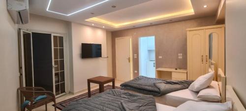Mansoura Hotel | رويال هوم للغرف والشقق الفندقية والإقامة