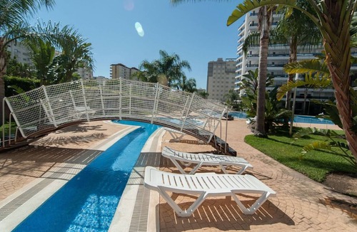 Playa de Gandia Apartment | Amazing modern style condo, wifi free, interantional channels, heating swimming pool, children's area, BBQ - only families
