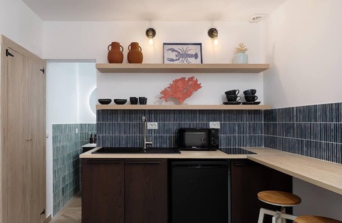 Portimao City Centre Apartment | Charming historic tiny house in Portimão's vibrant old town, steps from the marina and promenade. Easy access to Algarve beaches. Sleeps 4. Pets welcome. Self check-in via lockbox.