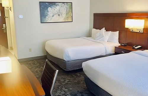 North Myrtle Beach Hotel | Explore Barefoot Landing then Relax in Indoor Pool Retreat | 4 Rooms