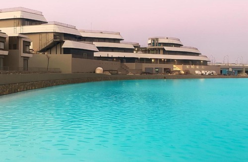 Marina El Alamein Apartment | Hotel-Style, Palm Hills New Alamein, Pool View, Lagoon & Mall Access