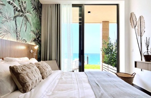 Kfardebian House | Palm Paradise: Beachfront Exotic Room in Batroun