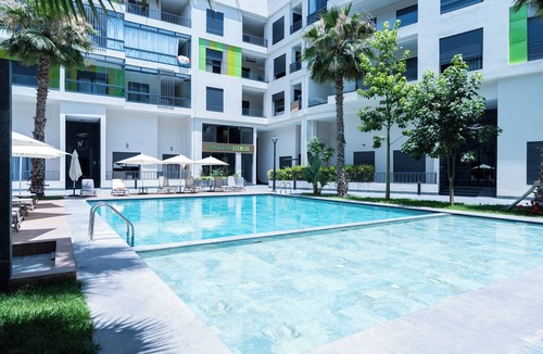 Mohammedia Apartment | Refined Comfort — Pool, Fitness Center & Kids Club