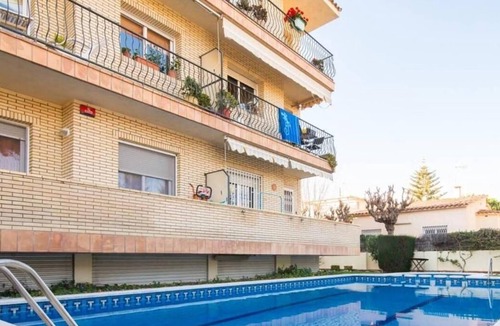 Castelldefels Apartment | Sunny apartment close to the beach with Pool, Garden, Terrace, Balcony, A/C & Wi-Fi