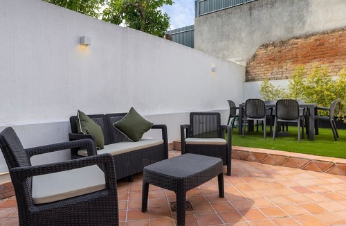 Santa Engracia Apartment | Sunny Garden 2BDR Apartment by LovelyStay