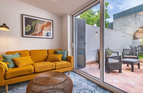 Santa Engracia Apartment | Sunny Garden 2BDR Apartment by LovelyStay