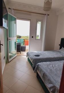 Achakkar Apartment | Appartement avec piscines, vue sur mer et accès à la plage à Achakar Hill, Tanger.